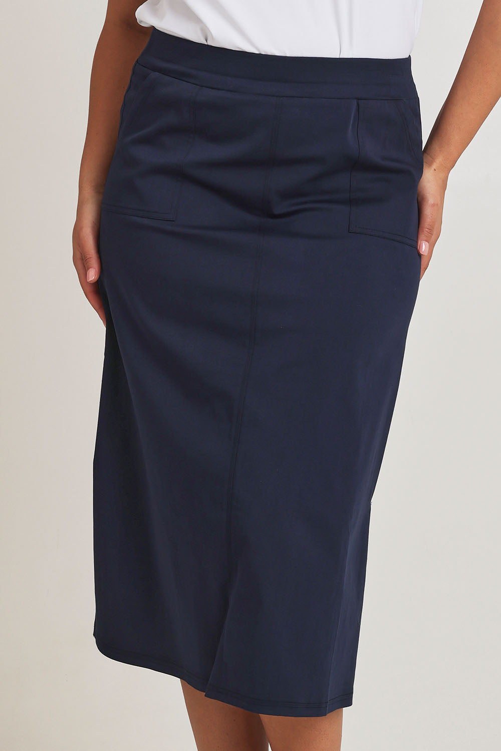 Model Terri-Leigh wearing size 14 of The Tencel Blend Pull On  Skirt in colour Navy (Blue), from the back
