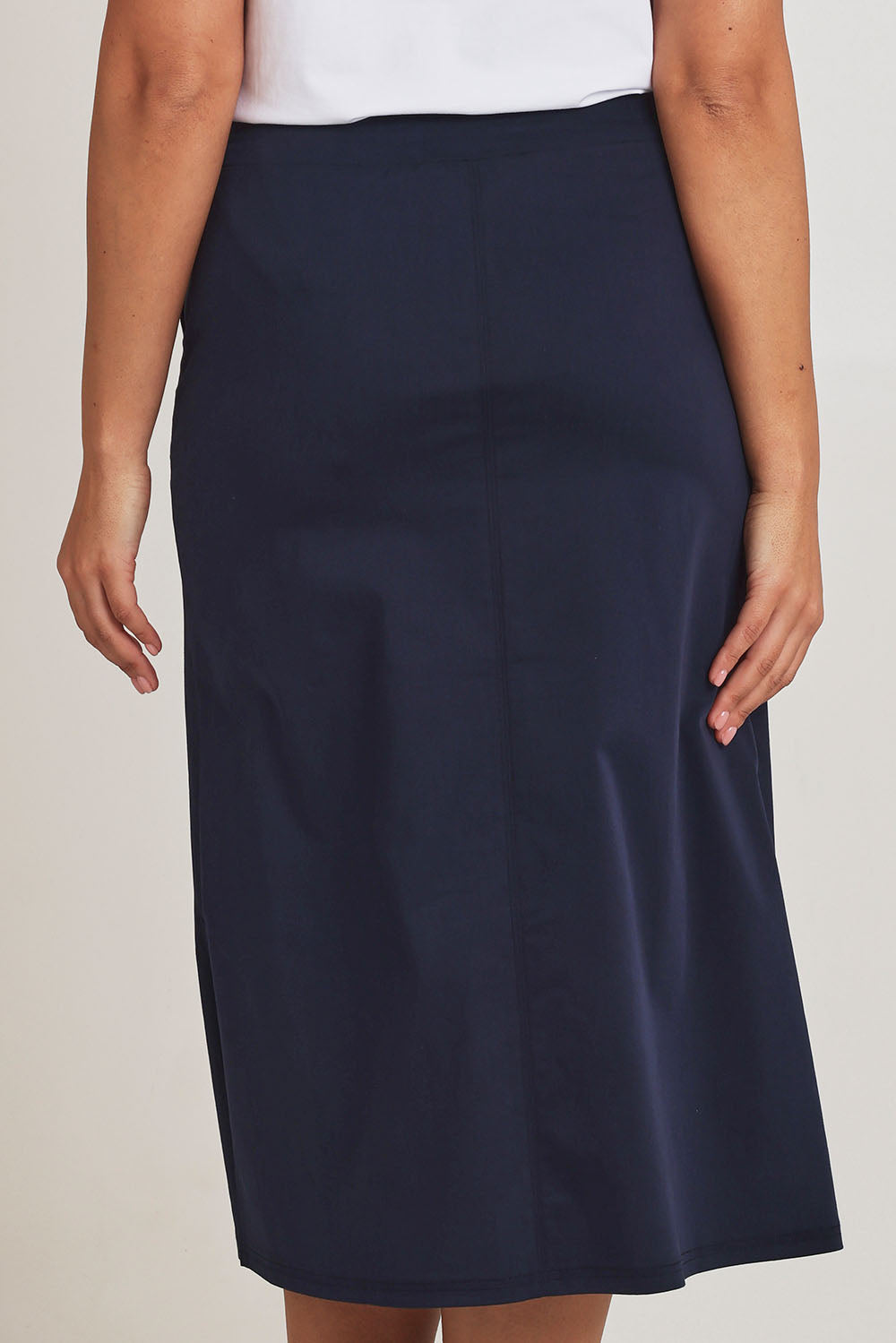 Model Terri-Leigh wearing size 14 of The Tencel Blend Pull On  Skirt in colour Navy (Blue), from the back