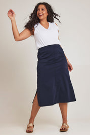 Model Terri-Leigh wearing size 14 of The Tencel Blend Pull On  Skirt in colour Navy (Blue), from the front, showing the whole outfit