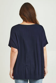 Model Jane wearing size L of The All Season V Neck High Low Tee in colour Darklapis (Blue), from the back
