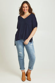 Model Jane wearing size L of The All Season V Neck High Low Tee in colour Darklapis (Blue), from the front, showing the whole outfit