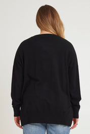 Model Chanel wearing size XL of The Modal Blend Crew Neck Jumper in colour Black (Black), from the back