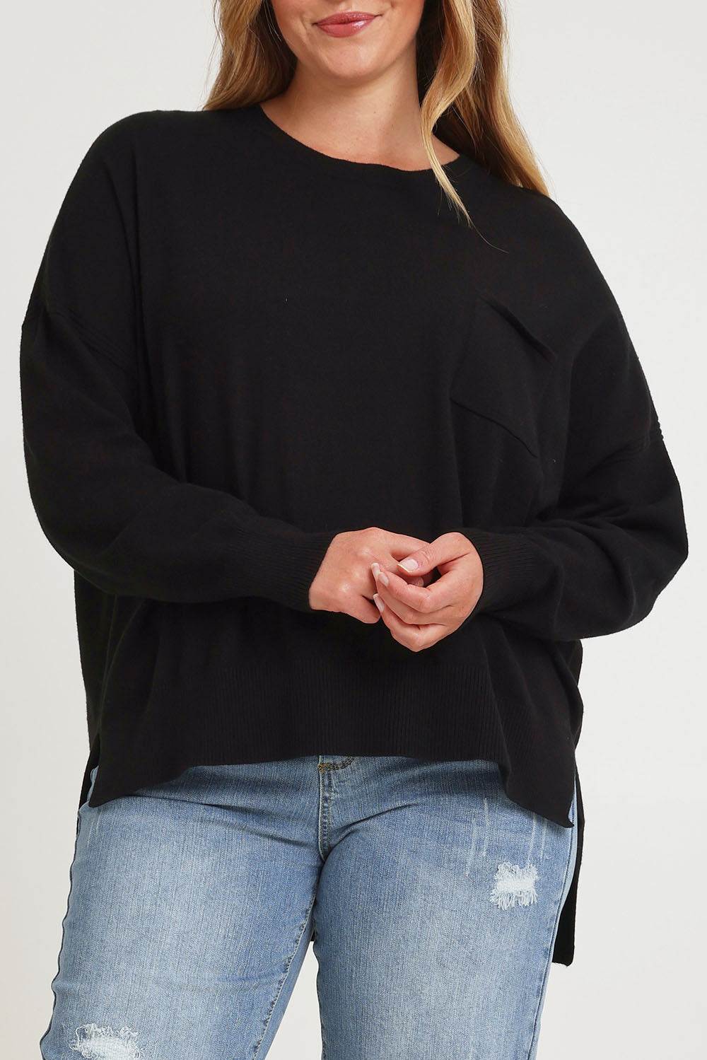 Model Chanel wearing size XL of The Modal Blend Crew Neck Jumper in colour Black (Black), from the front, cropped image