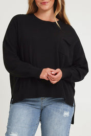 Model Chanel wearing size XL of The Modal Blend Crew Neck Jumper in colour Black (Black), from the front, cropped image