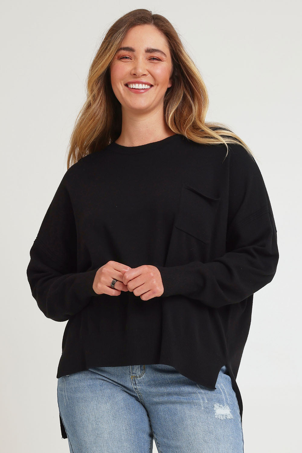 Model Chanel wearing size XL of The Modal Blend Crew Neck Jumper in colour Black (Black), from the front, cropped image