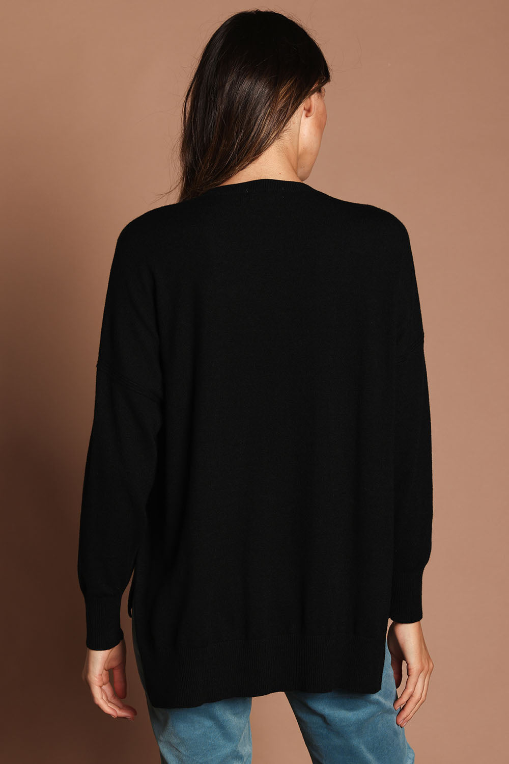 Model Madeline wearing size S of The Modal Blend Crew Neck Jumper in colour Black (Black), from the back