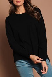 Model Madeline wearing size S of The Modal Blend Crew Neck Jumper in colour Black (Black), from the front, cropped image