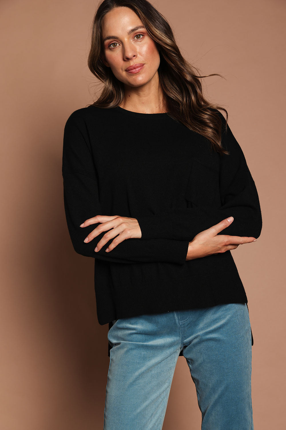 Model Madeline wearing size S of The Modal Blend Crew Neck Jumper in colour Black (Black), from the front, showing the whole outfit