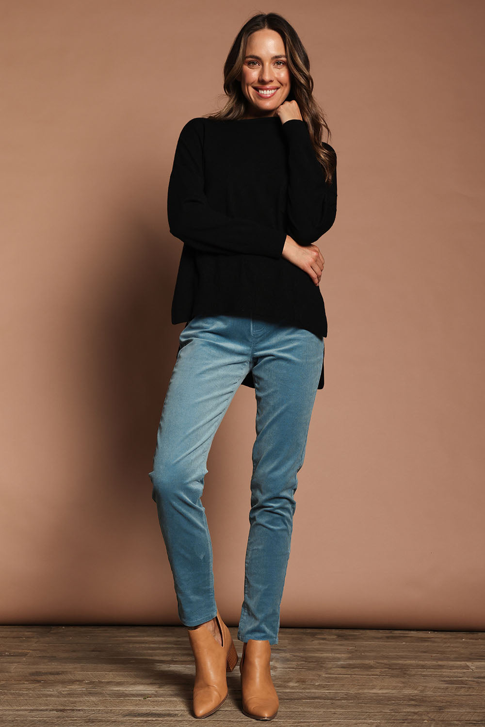 Model Madeline wearing size S of The Modal Blend Crew Neck Jumper in colour Black (Black), from the front, showing the whole outfit