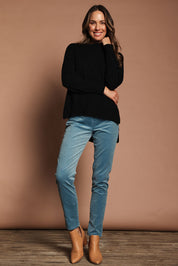 Model Madeline wearing size S of The Modal Blend Crew Neck Jumper in colour Black (Black), from the front, showing the whole outfit