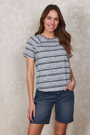 Model Madeline wearing size 10 of The Striped Raglan Sleeve Tee in colour Navystripe (Blue), from the front, showing the whole outfit