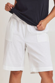 Model Terri-Leigh wearing size 14 of The Rib Waistband Short in colour White (White), from the front, cropped image