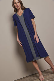 Model Madeline wearing size 10 of The Pack & Go Luxe Bamboo Button Up Dress with Pockets in colour Frenchnavy (Blue), from the front, showing the whole outfit