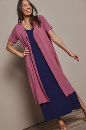 Model Amanda wearing size 10 of The Pack & Go Luxe Bamboo Button Up Dress with Pockets in colour Smokeyrose (Pink), from the front, cropped image