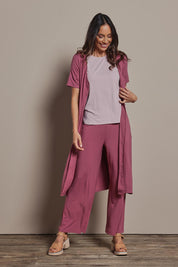 Model Amanda wearing size 10 of The Pack & Go Luxe Bamboo Button Up Dress with Pockets in colour Smokeyrose (Pink), from the front, showing the whole outfit