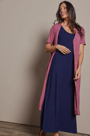 Model Amanda wearing size 10 of The Pack & Go Luxe Bamboo Button Up Dress with Pockets in colour Smokeyrose (Pink), from the front, showing the whole outfit