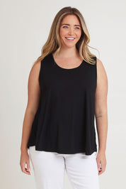 Model Chanel wearing size 16 of The Pack & Go Luxe Bamboo Swing Tank in colour Black (Black), from the front, cropped image
