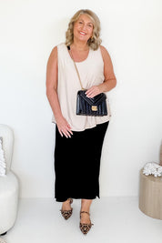 Model Bev wearing size 14 of The Pack & Go Luxe Bamboo Swing Tank in colour Nougat, from the front, showing the whole outfit