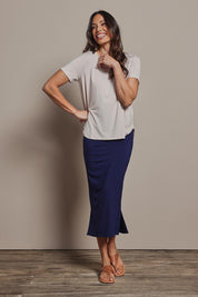 Model Amanda wearing size 10 of The Pack & Go Luxe Bamboo Pull On Maxi Skirt in colour Frenchnavy (Blue), from the front, showing the whole outfit
