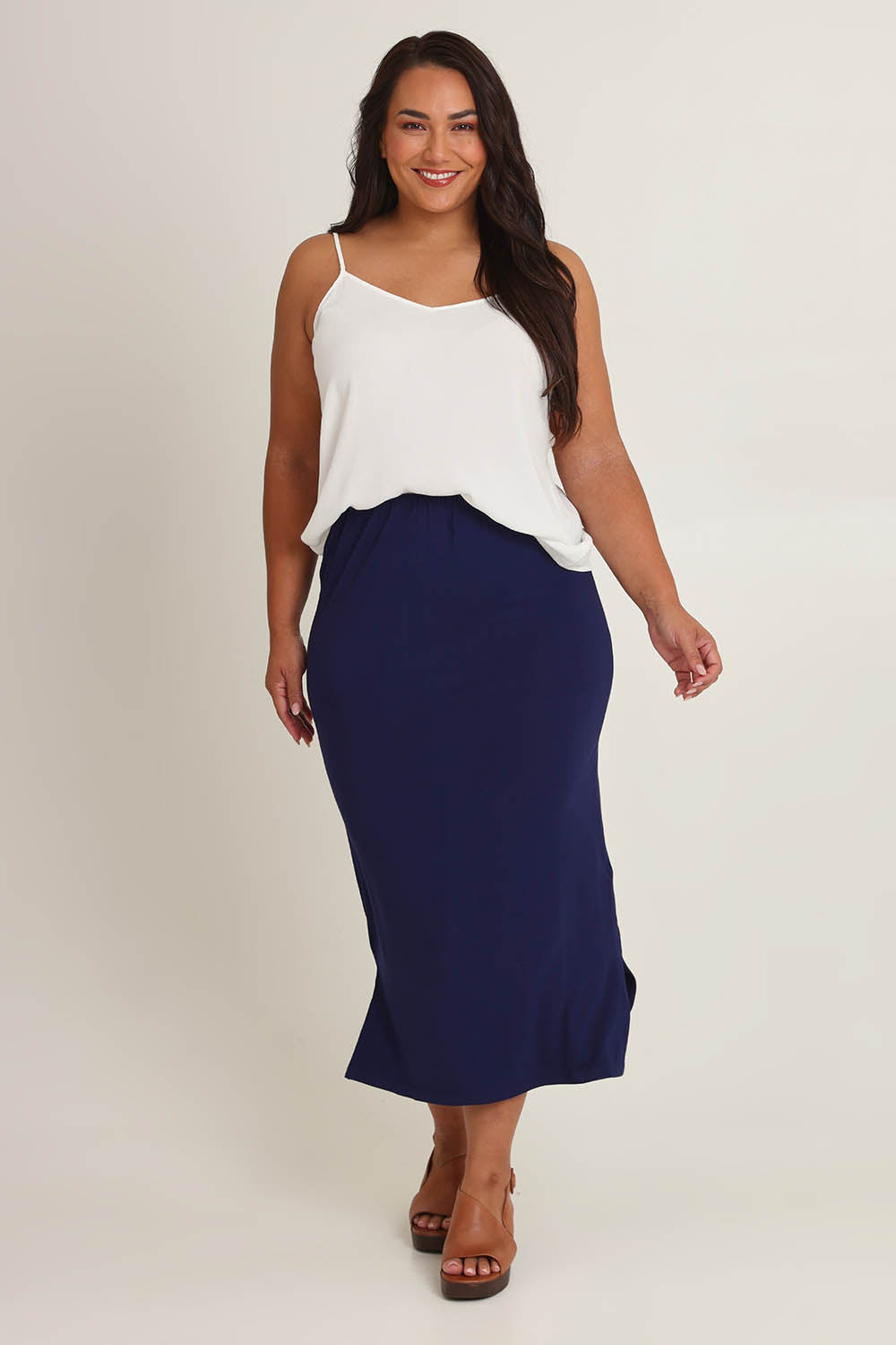 Model Ashleigh wearing size 16 of The Pack & Go Luxe Bamboo Pull On Maxi Skirt in colour Frenchnavy (Blue), from the front, showing the whole outfit