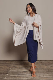 Model Nathalie wearing size 10 of The Pack & Go Luxe Bamboo Pull On Maxi Skirt in colour Frenchnavy (Blue), from the front, showing the whole outfit