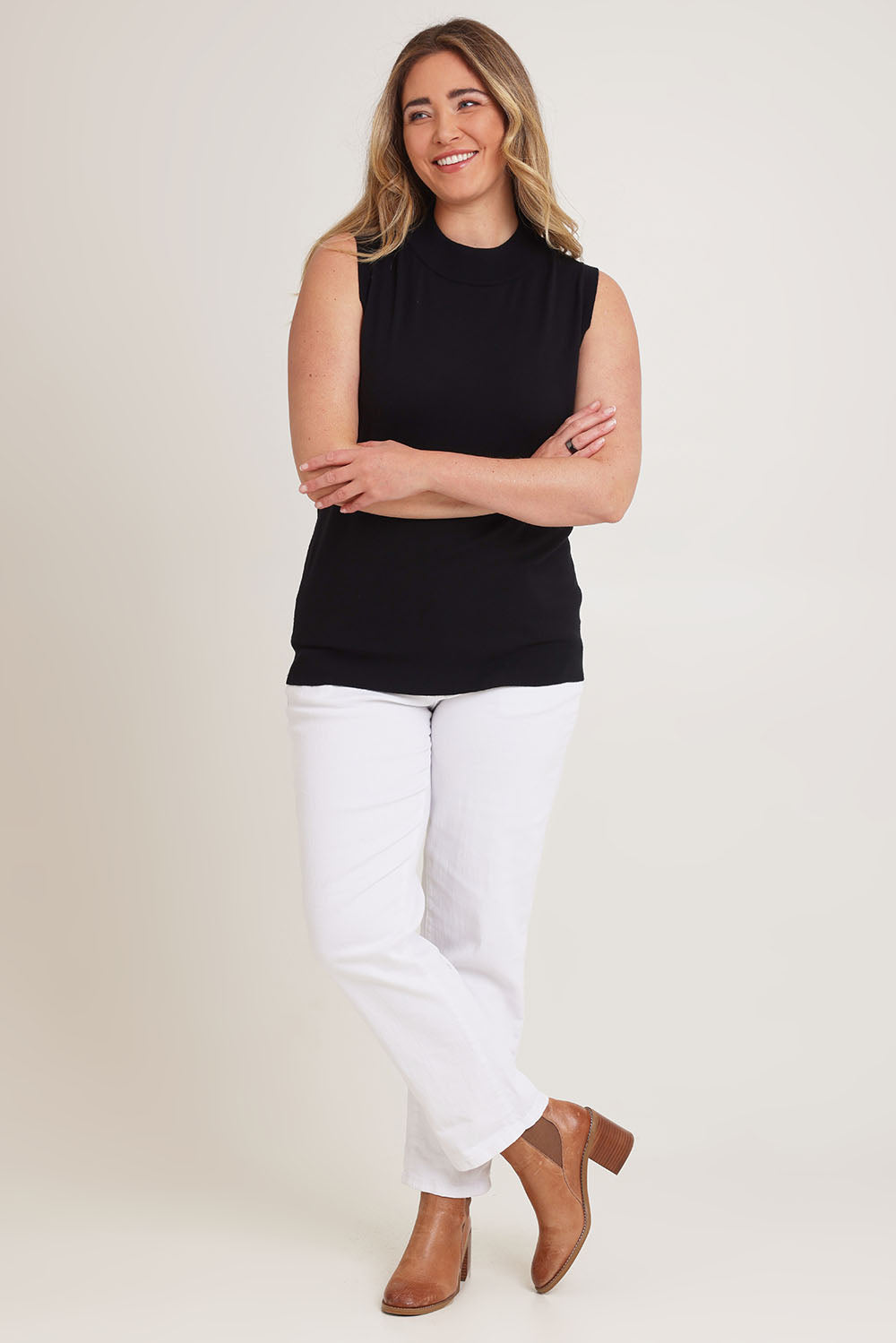 Model Chanel wearing size XL of The Modal Blend Mockturtle Vest in colour Black (Black), from the front, showing the whole outfit