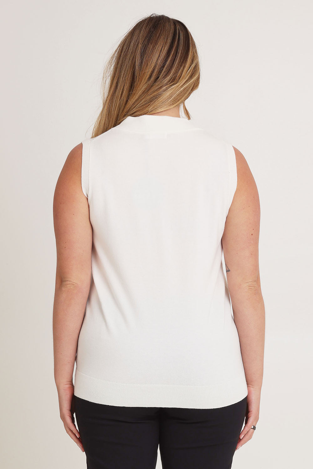 Model Chanel wearing size XL of The Modal Blend Mockturtle Vest in colour White (White), from the back