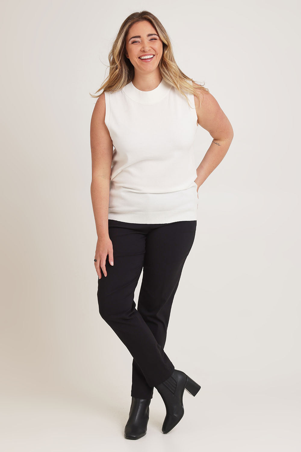 Model Chanel wearing size XL of The Modal Blend Mockturtle Vest in colour White (White), from the front, showing the whole outfit