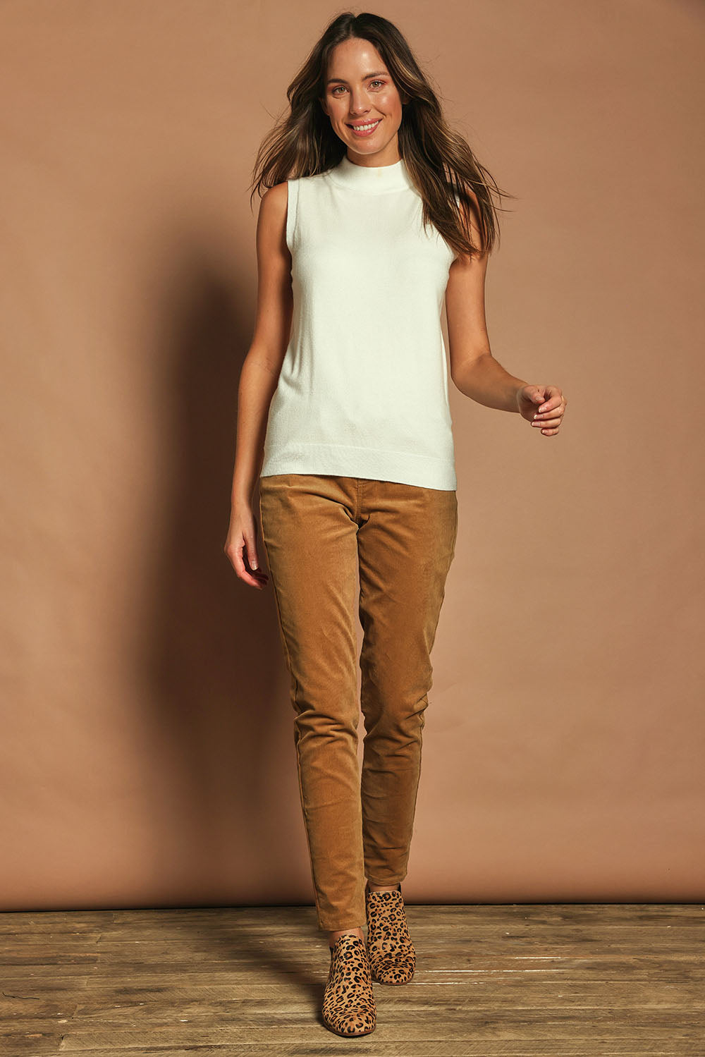 Model Madeline wearing size S of The Modal Blend Mockturtle Vest in colour White (White), from the front, showing the whole outfit