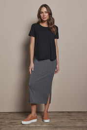 Model Madeline wearing size 10 of The Pack & Go Luxe Bamboo Tee in colour Black (Black), from the front, showing the whole outfit