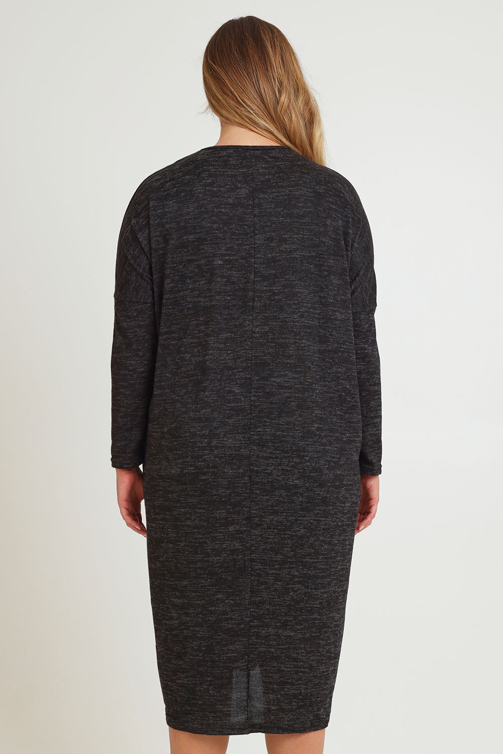 Model Chanel wearing size 16 of The Relaxed L/S Tee Dress With Pockets in colour Blackmarle (Black), from the back
