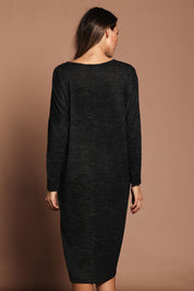 Model Madeline wearing size 10 of The Relaxed L/S Tee Dress With Pockets in colour Blackmarle (Black), from the back