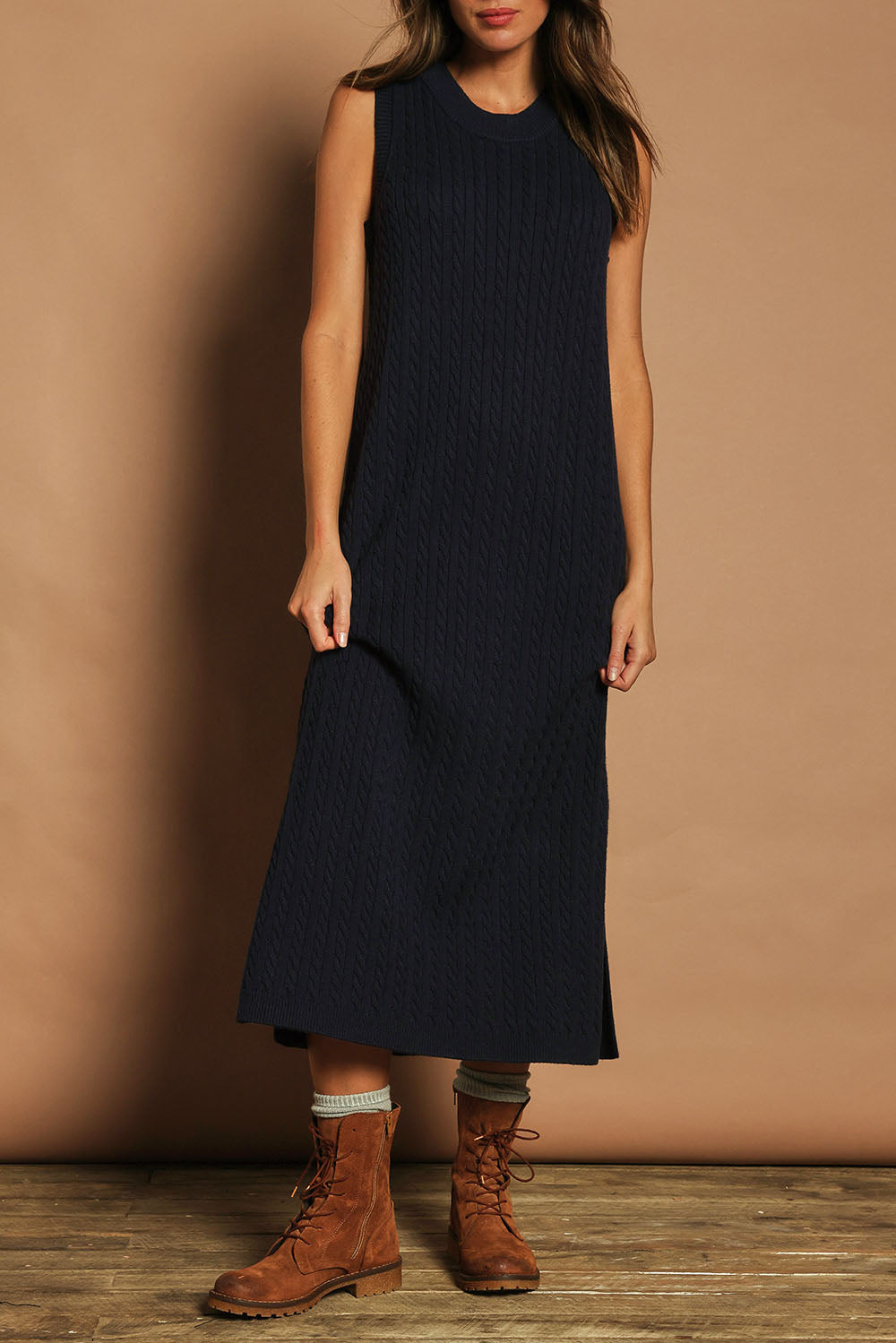 Model Madeline wearing size S of The Mock Turtle Cable Maxi Dress in colour Darknavy (Blue), from the front, cropped image