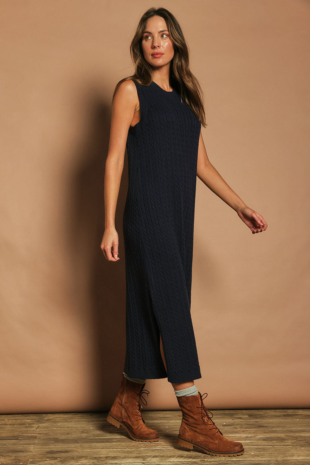 Model Madeline wearing size S of The Mock Turtle Cable Maxi Dress in colour Darknavy (Blue), from the front, showing the whole outfit