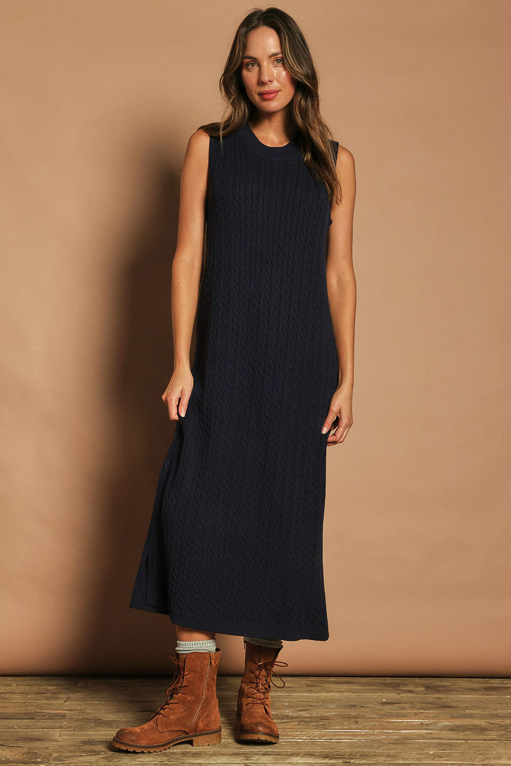 Model Madeline wearing size S of The Mock Turtle Cable Maxi Dress in colour Darknavy (Blue), from the front, showing the whole outfit