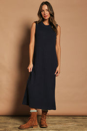 Model Madeline wearing size S of The Mock Turtle Cable Maxi Dress in colour Darknavy (Blue), from the front, showing the whole outfit