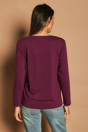 Model Madeline wearing size 10 of The Classic Long Sleeve Tee in colour Plum (Purple), from the back