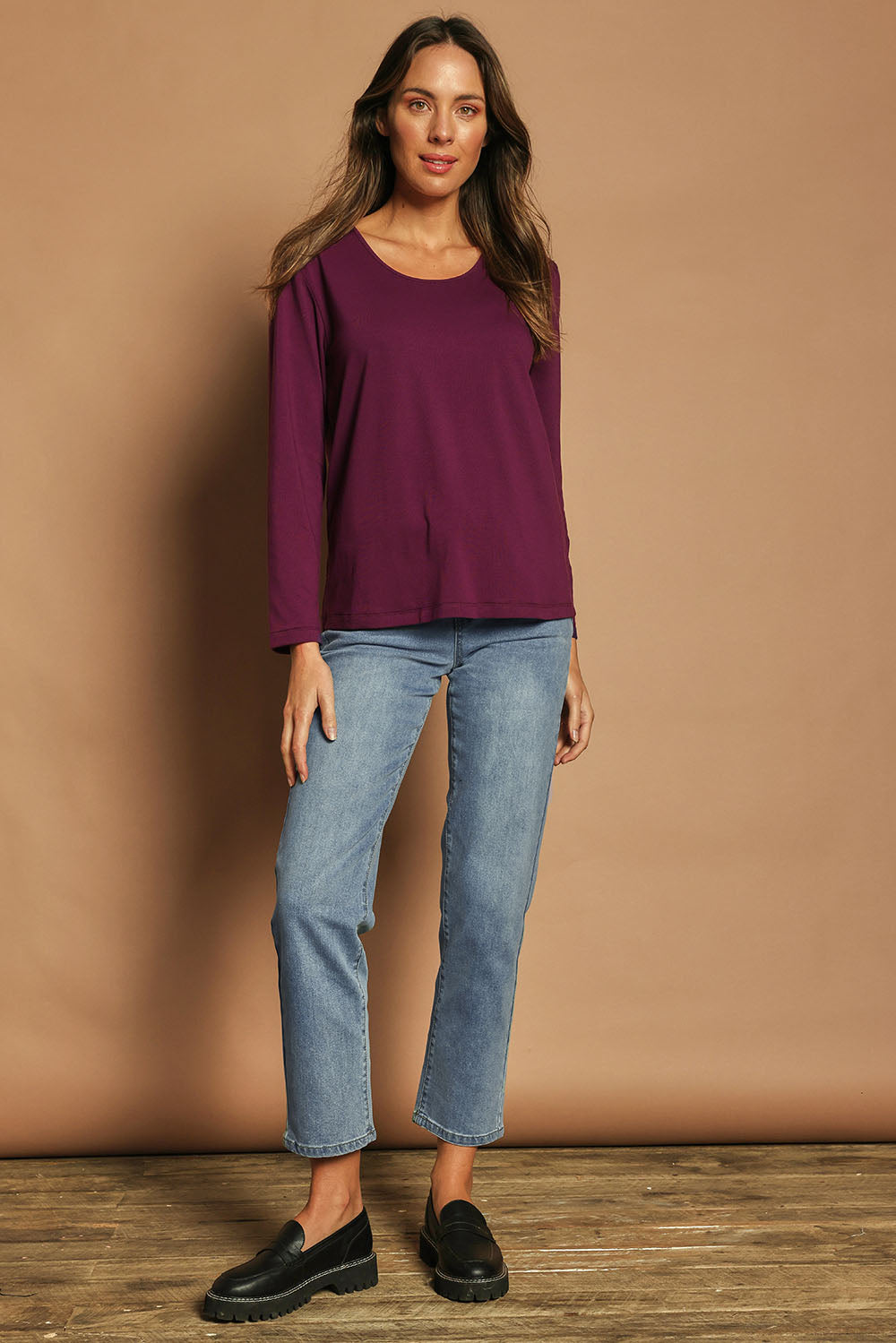 Model Madeline wearing size 10 of The Classic Long Sleeve Tee in colour Plum (Purple), from the front, showing the whole outfit