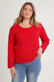Model Chanel wearing size 16 of The Classic Long Sleeve Tee in colour Red (Red), from the front, cropped image