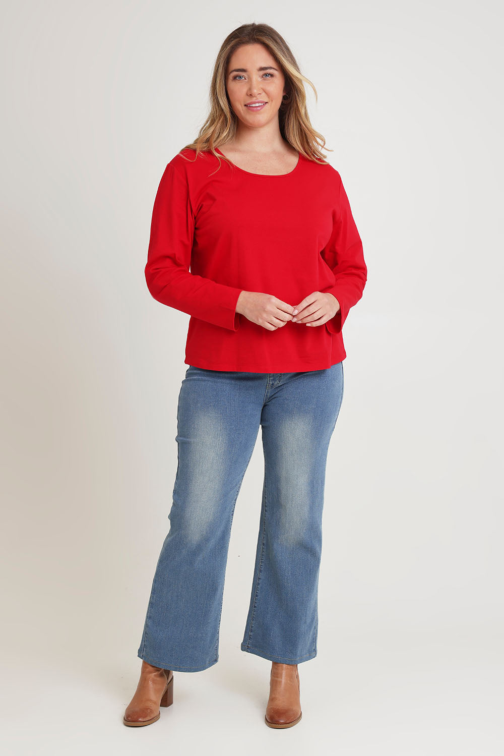 Model Chanel wearing size 16 of The Classic Long Sleeve Tee in colour Red (Red), from the front, showing the whole outfit