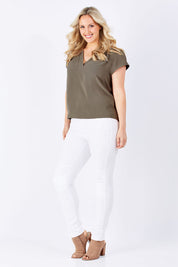 Model Jess wearing size 12 of The V Neck Blouse in colour Nickle, from the front, showing the whole outfit
