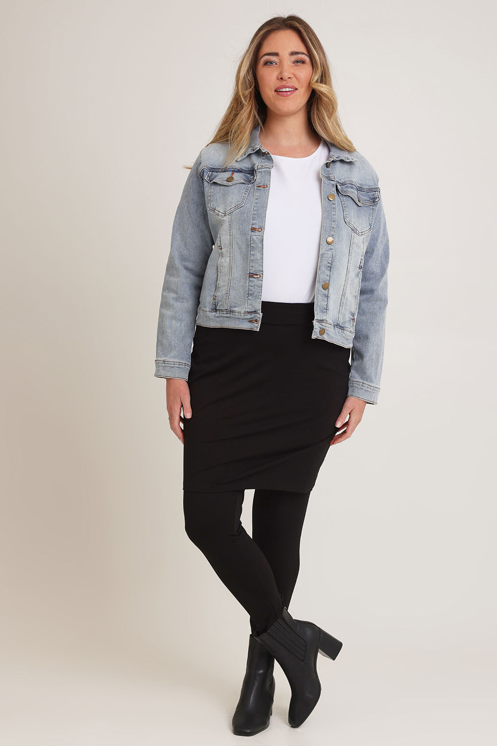Model Chanel wearing size 16 of The Keepers Skirted Legging in colour Black (Black), from the front, showing the whole outfit