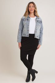 Model Chanel wearing size 16 of The Keepers Skirted Legging in colour Black (Black), from the front, showing the whole outfit