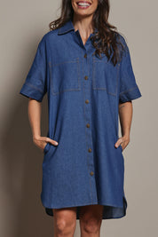 Model Amanda wearing size 10 of The S/S Chambray Shacket Dress With Pockets in colour Denim (Blue), from the front, cropped image