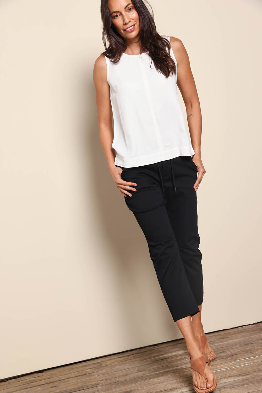 Model Amandam wearing size 10 of the The Pull On Cotton Pant With Drawstring – Black in colour Black, from the front