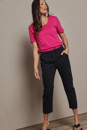 Model Amanda wearing size 10 of The Pull On Cotton Pant With Drawstring in colour Black (Black), from the front, showing the whole outfit