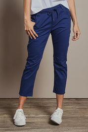 Model Amanda wearing size 10 of The Pull On Cotton Pant With Drawstring in colour Indigo (Blue), from the front, cropped image