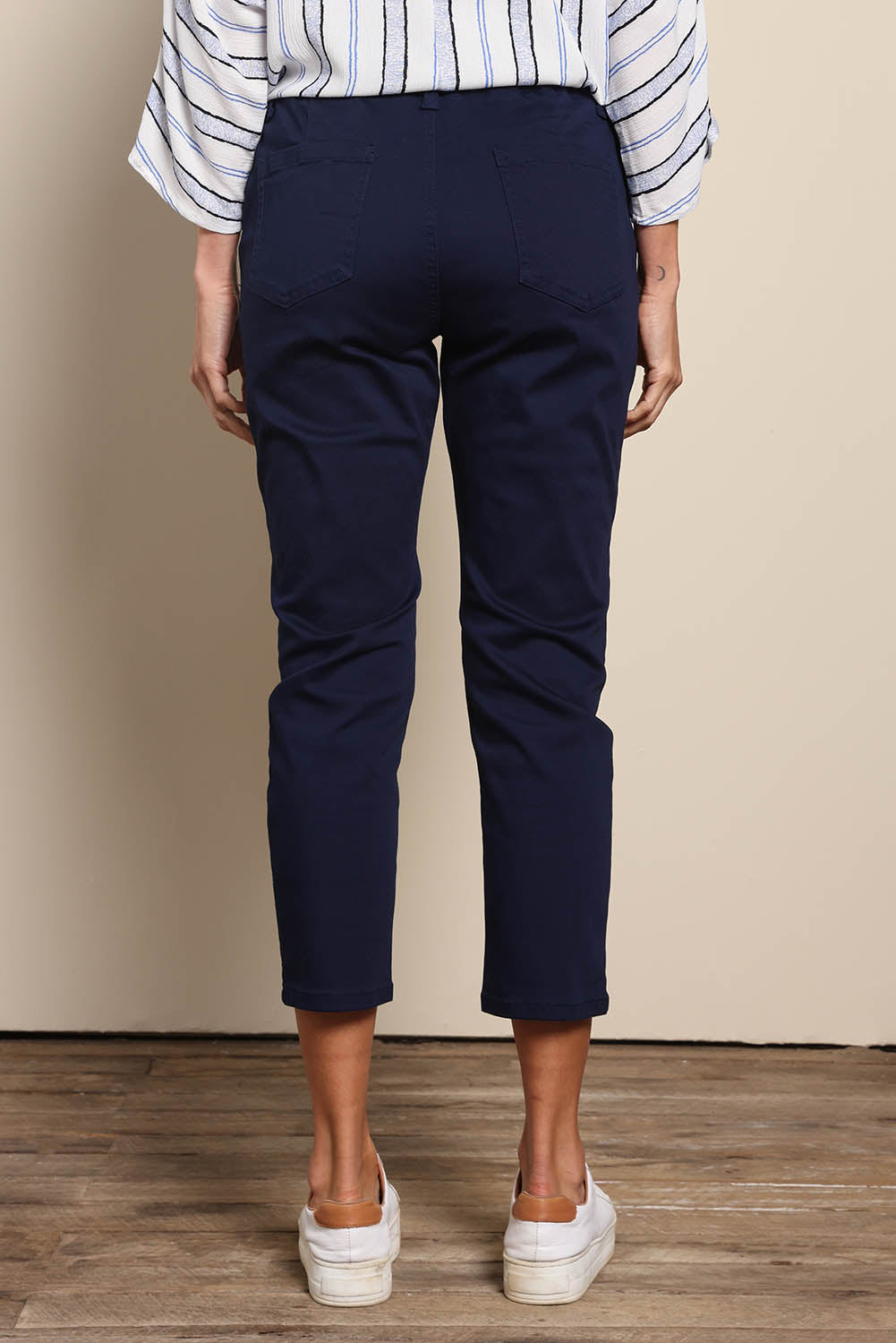 Model Amandam wearing size 10 of the The Pull On Cotton Pant With Drawstring – Navy in colour Navy, from the front