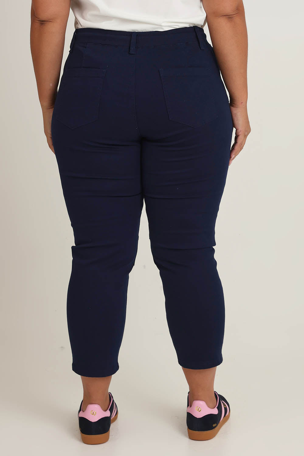 Model Ashleigh wearing size 16 of The Pull On Cotton Pant With Drawstring in colour Navy (Blue), from the back