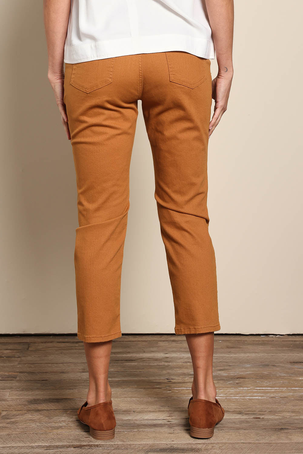 Model Amandam wearing size 10 of the The Pull On Cotton Pant With Drawstring – Rust in colour Rust, from the back